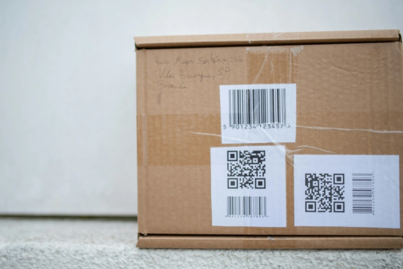 Box with barcode and QR code