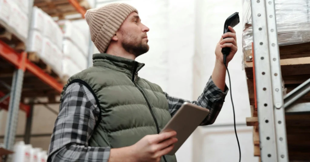 warehouseman scanning item in warehouse